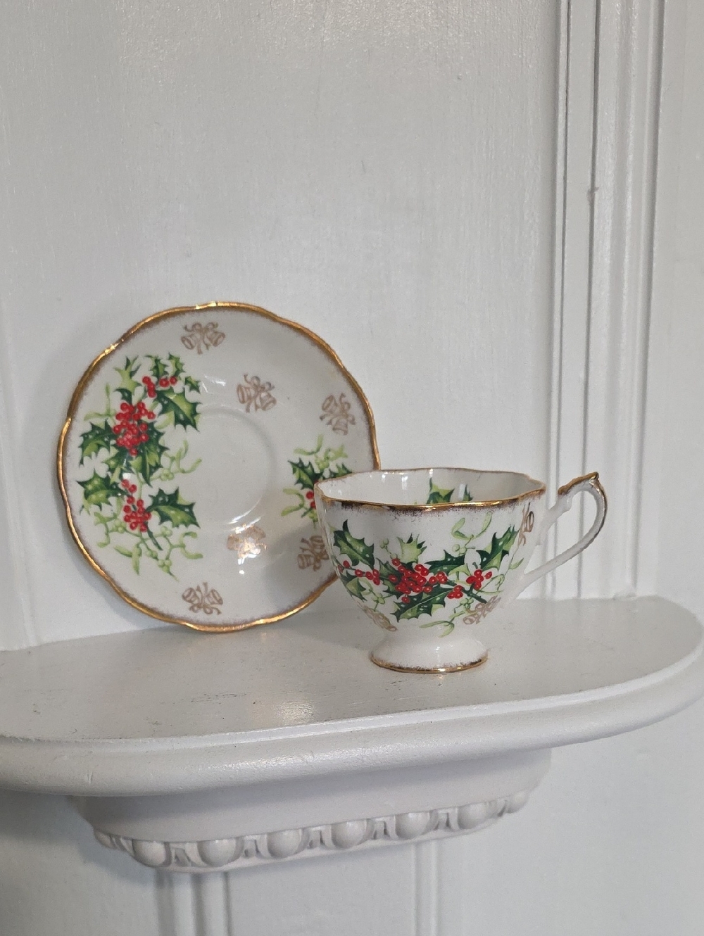 vintage bone china teacup and saucer set in the "Yuletide" pattern by Queen Anne